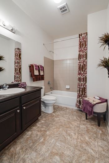 Spacious Bathroom With Tile-Style Floors